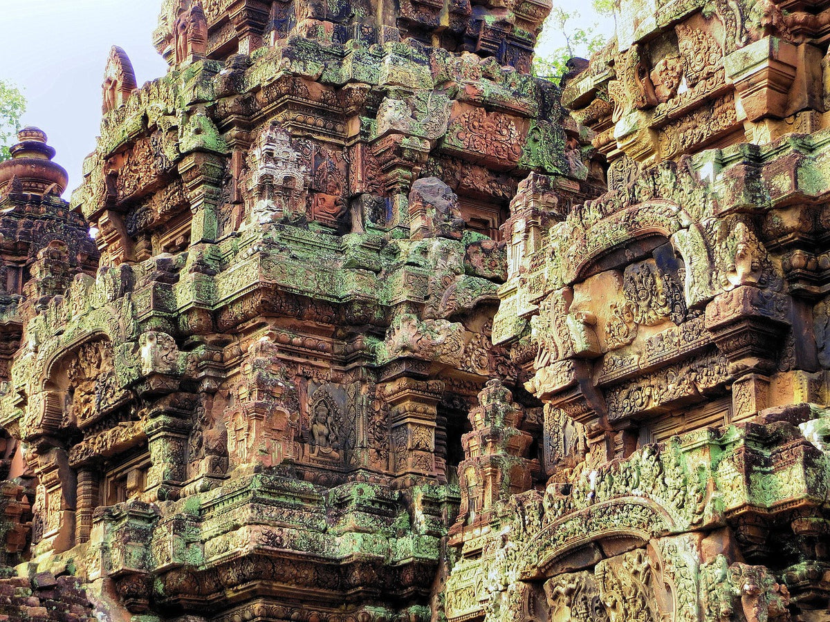 Intricately carved pink sandstone temple towers